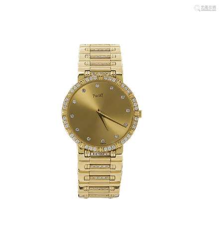 An 18ct gold and diamond quartz wristwatch by Piaget. the circular gilt dial with brilliant-cut