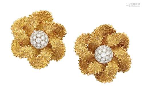 A pair of French, diamond earrings, each designed as a flower with pavé diamond bombé centre and