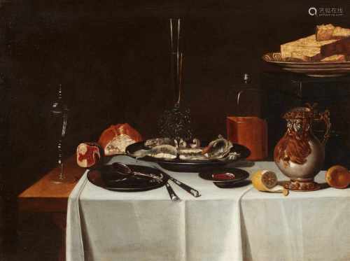 Netherlandish School, 17th centuryLarge Dinner Still Life with a Bellarmine, Venetian Glass,