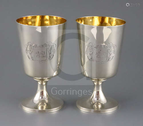 A pair of George III silver pedestal goblets, by Soloman Hougham?, of plain form with engraved