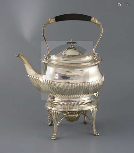 A late Victorian demi fluted tea kettle on stand and burner, by Edward Hutton, of shaped oval