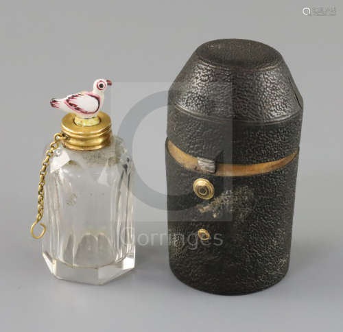 A late 18th century gold mounted glass scent bottle, the 'dove' stopper possibly St James porcelain,