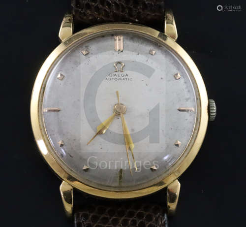 A gentleman's late 1940's 18ct gold Omega automatic wrist watch, the silvered dial with baton and