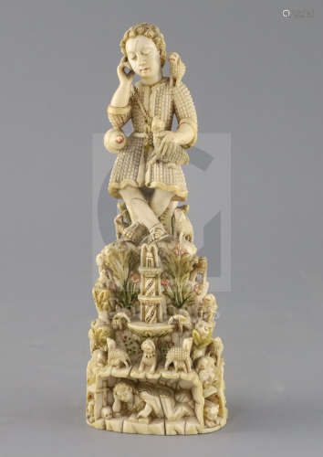 A 17th/18th century Indo-Goanese painted ivory group of Christ as the Good Shepherd, H.9.5in.