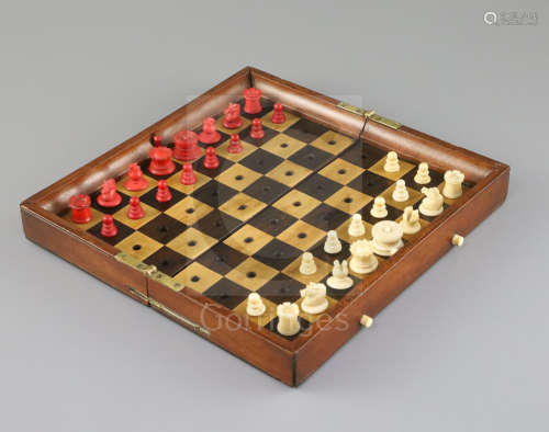 A Jaques & Son In Statu Quo mahogany and boxwood travelling chess set, with red stained and