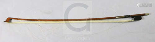 A nickel mounted cello bow, stamped 'Tubbs', the rounded stick appears to be of partridge wood, with