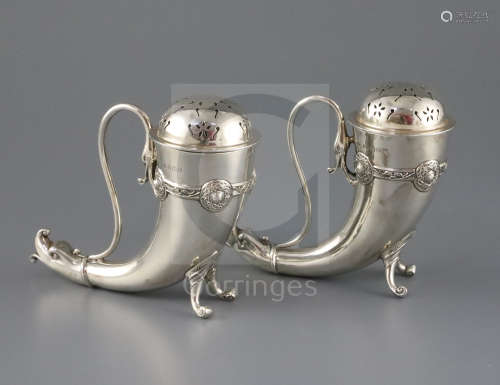 A pair of silver horn-shaped sugar casters with dolphin mask terminals, Birmingham 1929, Henry