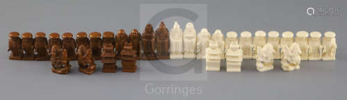 An unusual late 19th century Japanese brown stained and natural ivory figural chess set, modelled as