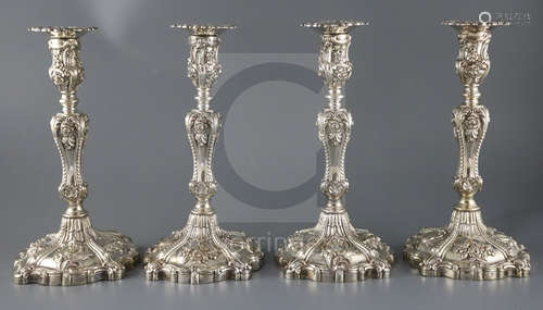 An ornate set of four Victorian rococco style silver candlesticks, Creswick & Co (Thomas James &