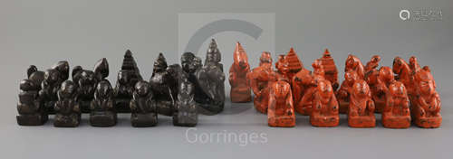 An 18th century red and black lacquer Burmese figural chess set, kings 3in.