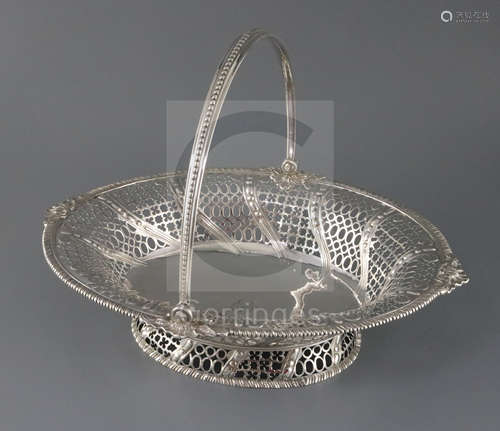 An early George III pierced silver oval bread basket, by Edward Aldridge, with engraved armorial and