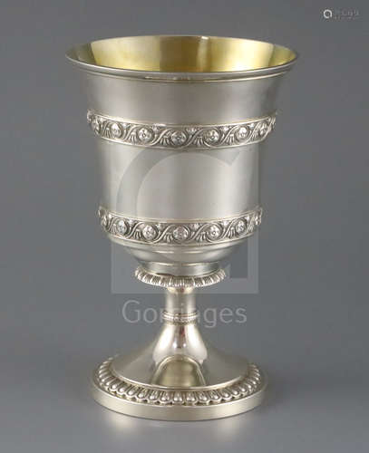 A George III silver pedestal cup or vase by Robert & Samuel Hennell, with bands of flowerheads in