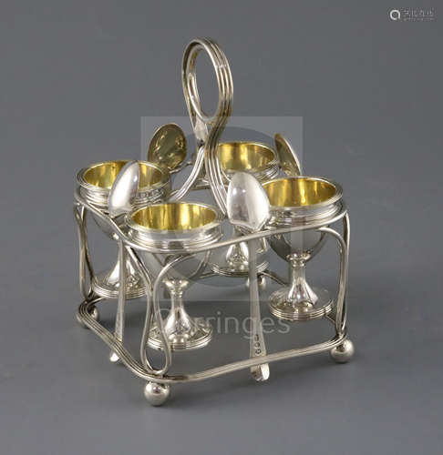 A George III silver open wirework egg cruet by Joseph Angell I, of square form, with four cups and