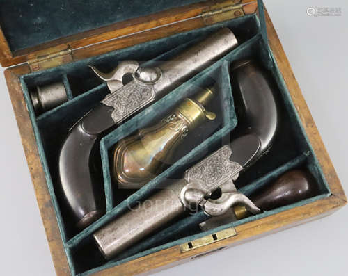 A pair of early 19th century box percussion lock pocket pistols, with scrolling engraved decoration,