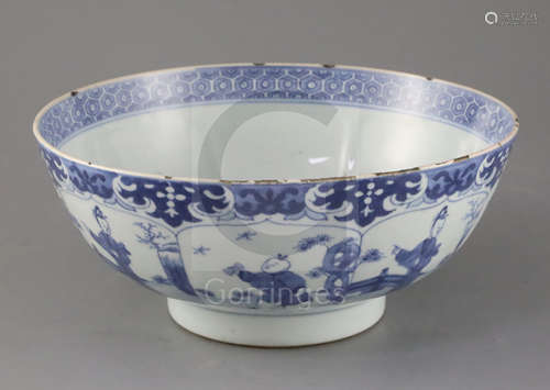 A Chinese blue and white petal lobed bowl, Kangxi period, the interior painted with a lady holding a