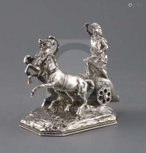 A late 19th century Hanau silver miniature model of a Roman charioteer with two rearing horses, on