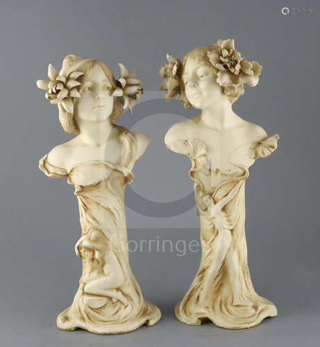 A pair of Ernst Wahliss Art Nouveau busts of ladies, c.1905, each lady with flowers in her hair, the