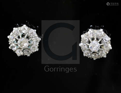 A pair of white gold and diamond cluster ear studs, each set with ten round cut stones, 10mm,.