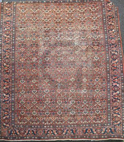 A Mahal red ground carpet, with field of geometric foliate motifs, 12ft 8in x 10ft 9in.