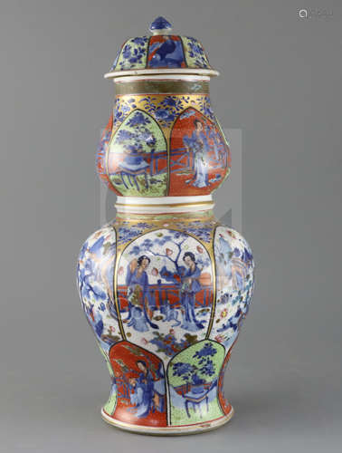 A large Chinese clobbered blue and white double gourd vase and cover, Kangxi period, painted with