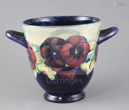 A William Moorcroft 'Pansy' jardiniere, c.1915, applied with a pair of looped handles, with a pale