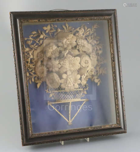 A George III cut-card relief picture, modelled as a basket of flowers, mounted within an ebonised