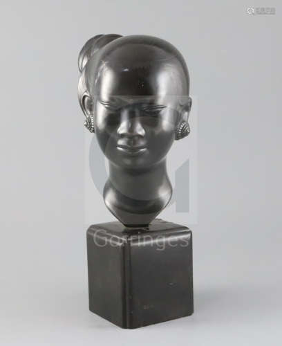 Nguyen Thanh Le (1919- Vietnam). A bronze head of a Vietnamese woman, signed, on black marble