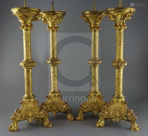 A set of four 19th century French Henri II style ormolu pricket candlesticks, decorated with