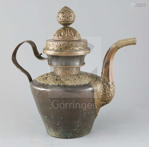 A Himalayan copper and repousse work teapot and cover, 19th century, the shoulder mount decorated