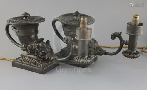 A near pair of Regency bronze Colza oil lamps, of rhyton form, with boars heads mounts, on square