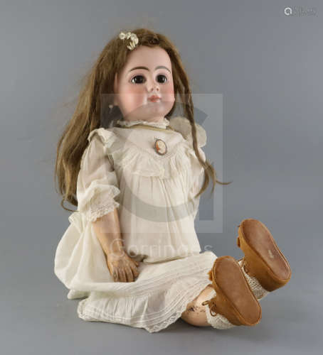 A French Dep doll, marked on head, with closed mouth, fixed eyes and fixed wrists, wearing vintage