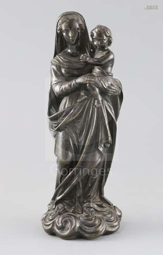 An early 19th century Italian bronze group of the Madonna and child, standing on a cloud base, H.