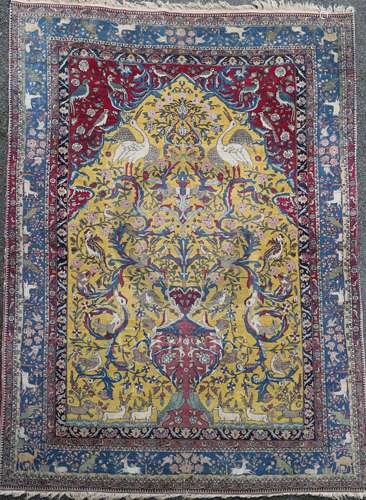 An antique North West Persian Tree of Life yellow ground carpet, with field of animals and birds