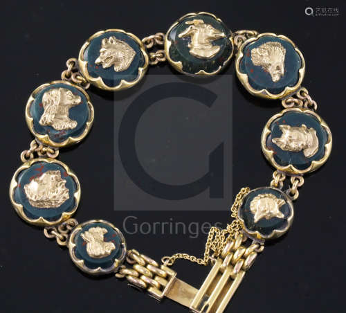 An early 20th century 9ct gold and bloodstone panel set bracelet, each stone mounted with a gold