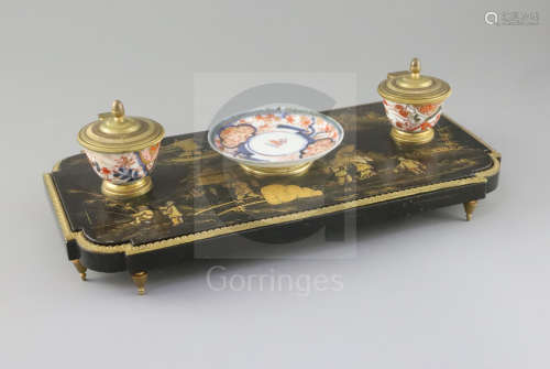 A French Louis XIV style ormolu mounted black lacquered ink stand, with Imari porcelain dish and