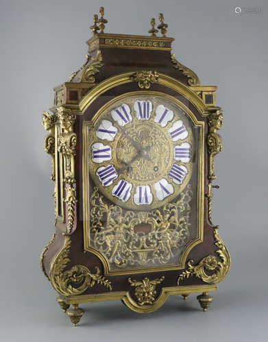 A 19th century French ormolu mounted red tortoiseshell mantel clock, with enamelled tablet