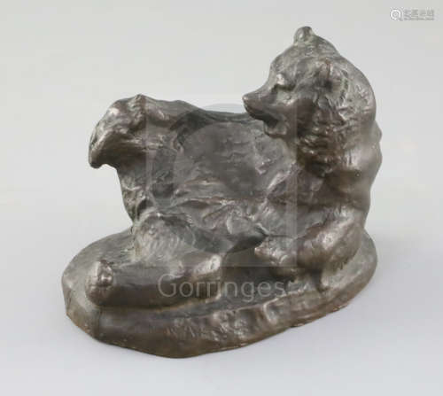 A Russian bronze figure of a reclining bear scratching its foot, 5in.