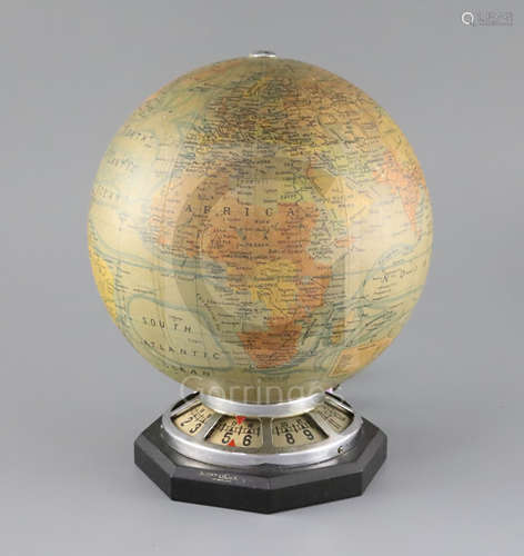 A Jaeger le Coultre electric revolving globe timepiece, with J Forest terrestrial globe over a