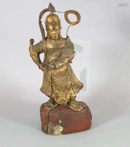 A large Chinese gilt-decorated and polychrome lacquer figure of a temple guardian, 19th century, the