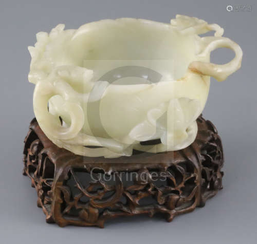 A Chinese pale celadon jade 'lotus' cup, late Ming dynasty, the cup formed as a lotus flower