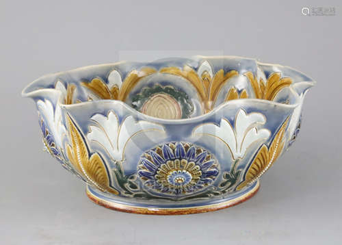 Frank A Butler for Doulton, an unusual lobed bowl, dated 1885, modelled with flowerheads and incised