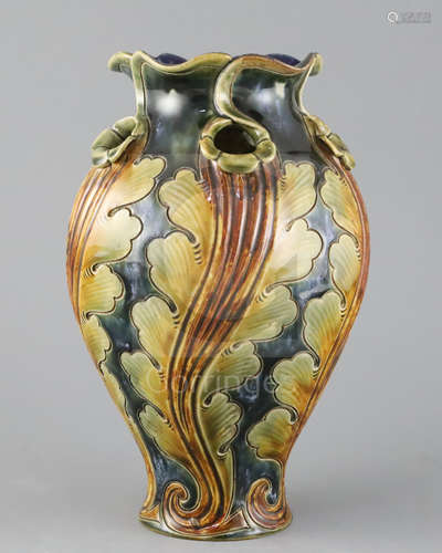 Frank A Butler for Doulton, a hand-built leaf design vase, c.1895, with wrythen modelled body and