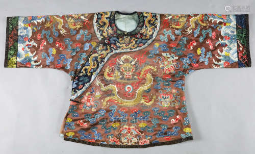 A Chinese embroidered silk and gold thread 'dragon' jacket, late Qing dynasty, the gold thread