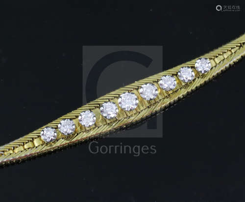 A mid 20th century Italian 18ct gold and graduated illusion set nine stone diamond set bracelet,
