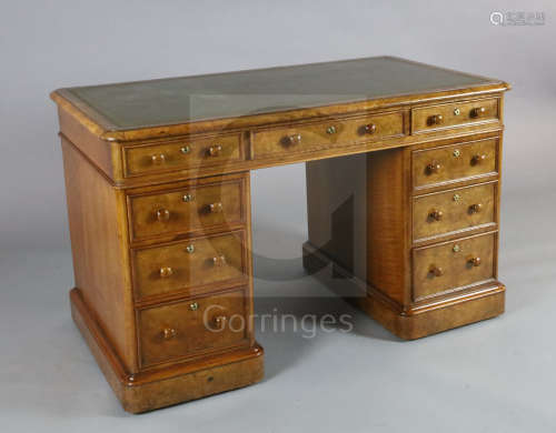 A Victorian walnut pedestal desk, with gilt green skiver and nine drawers fitted Bramah locks, W.4ft