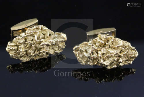A pair of 1970's 18ct gold modernist cufflinks, of nugget form, cufflink head 29mm.