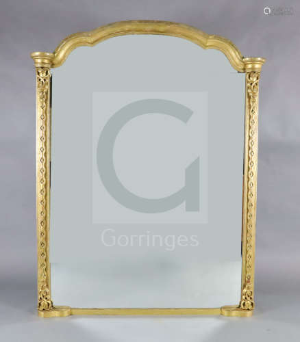 A Victorian giltwood overmantel mirror, with arched top and blind fret carved pilasters, W.4ft
