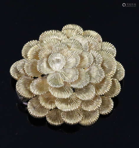 A 1960's Kutchinsky textured 18ct gold flower head clip brooch, signed en verso, 38mm.