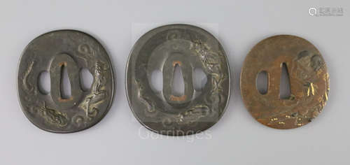 A set of Japanese daisho tsuba and a bronze and mixed metal tsuba, 19th century, the matching