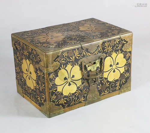 A Japanese black lacquer travelling chest, Meiji period, with gilt copper mounts and gilt